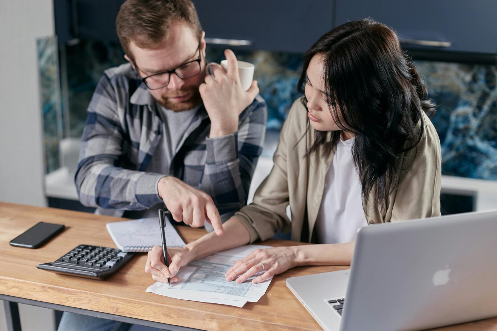 8 Strategies for Tackling "Technical Debt" at Your Company 3 Free couple calculating al their bills stock photo