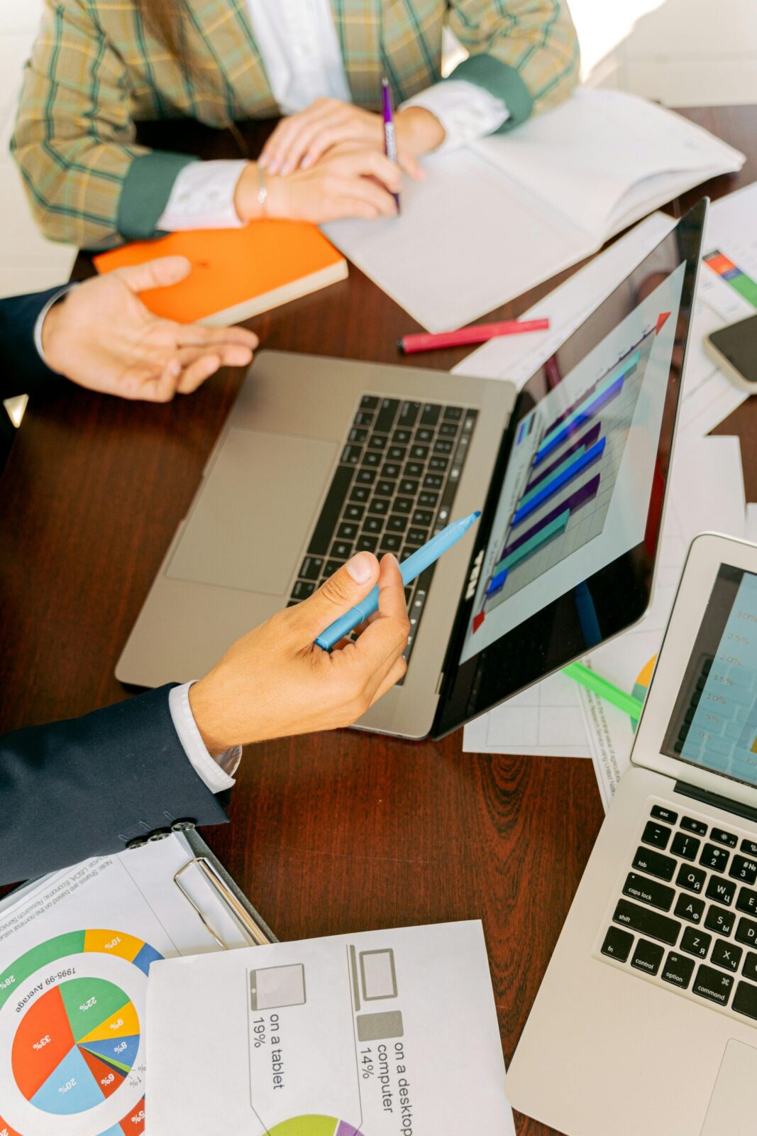 Navigating the Challenges of Data Lifecycle Management 2 Free A Person in Black Suit Holding a Pen Stock Photo