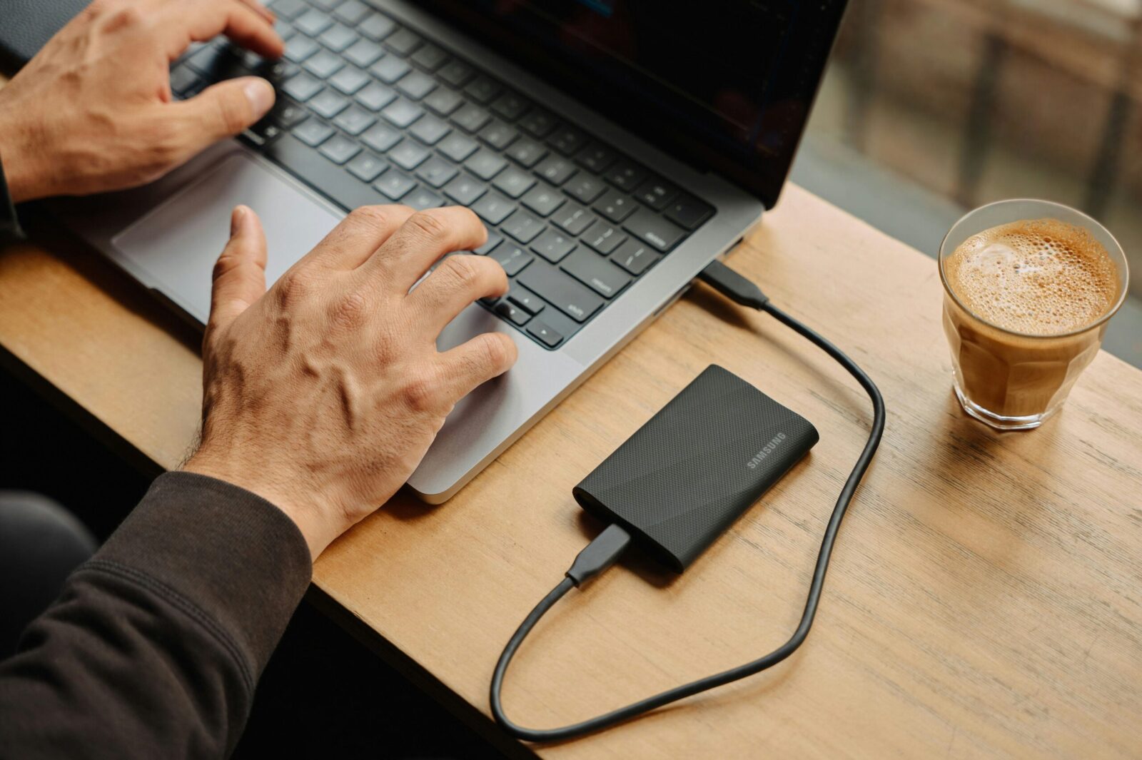 Guide to Secure File Storage and Transfers 1 A man sitting at a table using a laptop computer